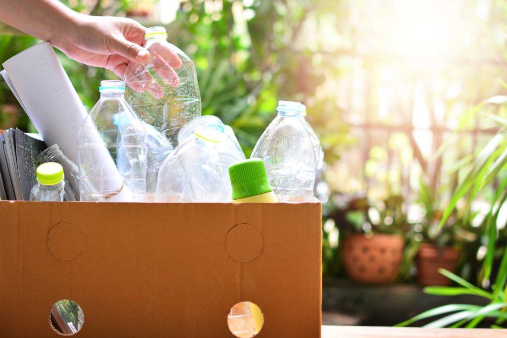 box of recyling and hand